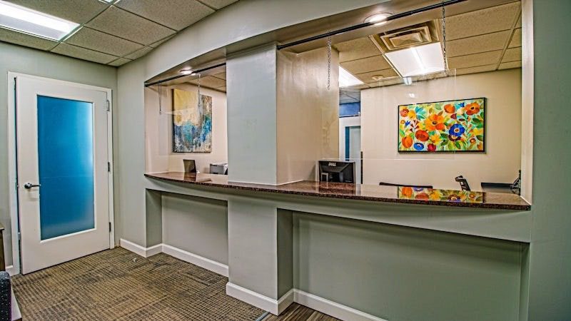 Reception desk with colorful artwork