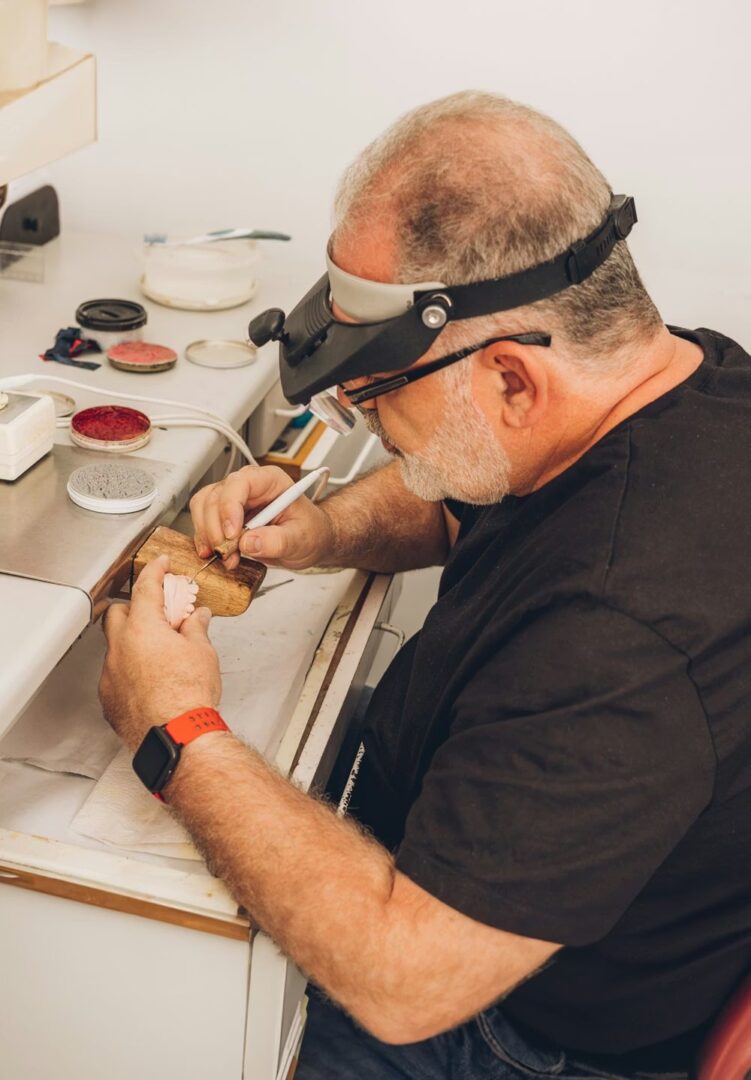 Artisan working on detailed piece