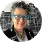 Woman with glasses and short curly hair