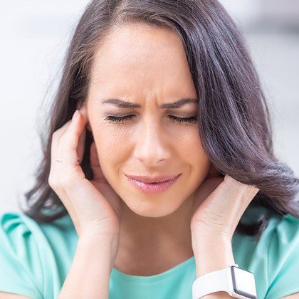 Person experiencing ear pain